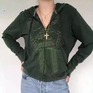 Green Nike vintage zip-up hoodie.